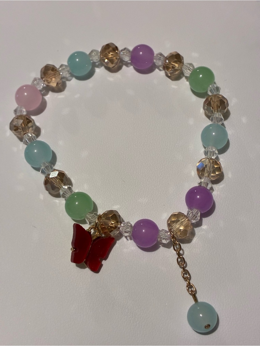 Delicate Pastel Beaded Bracelet with Red Butterfly Charm